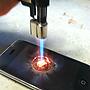 iPhone being burnt with a butane lighter. [1071x1435]